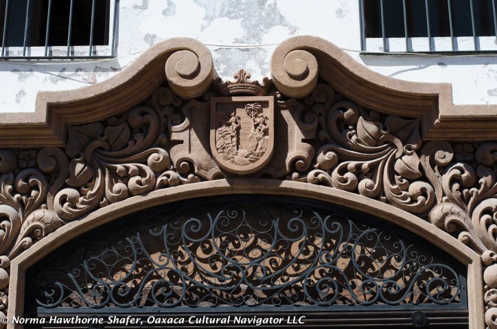 Hand carved colonial wood detailing on doorway arch