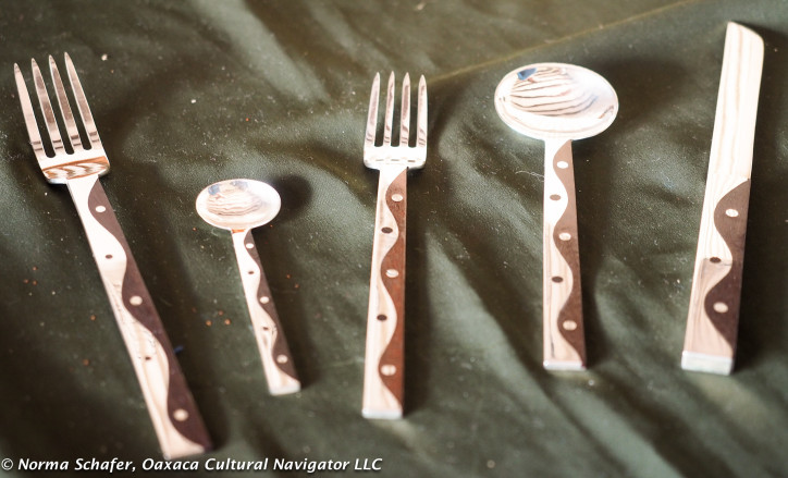 Sterling silver flatware with rosewood, $1,000 USD a place setting