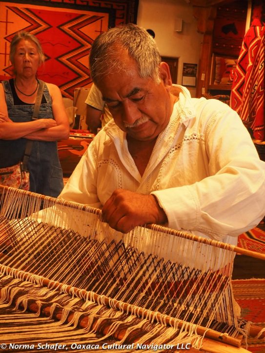 Arturo demonstrates back-strap loom weaving at Malouf's on the Plaza